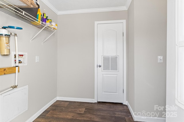 clothes washing area featuring washer hookup, dark hardwood / wood-style flooring, and ornamental molding