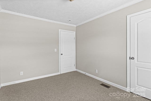 carpeted spare room featuring crown molding and a textured ceiling