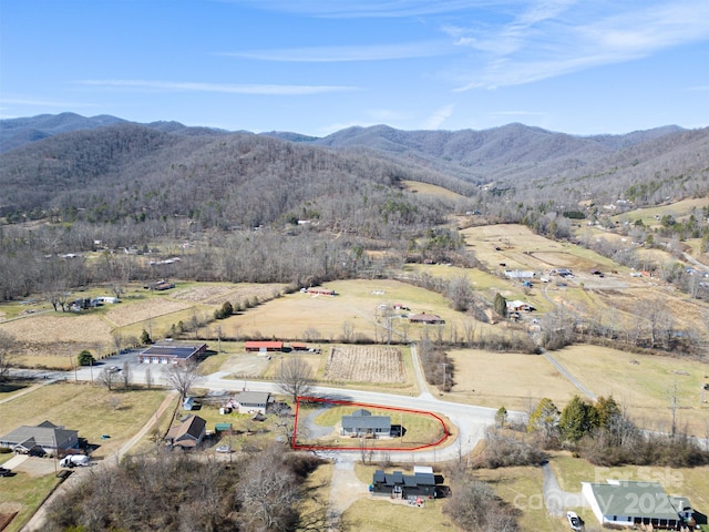 drone / aerial view with a mountain view and a rural view