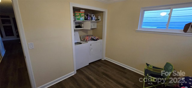 clothes washing area with laundry area, separate washer and dryer, dark wood finished floors, and baseboards