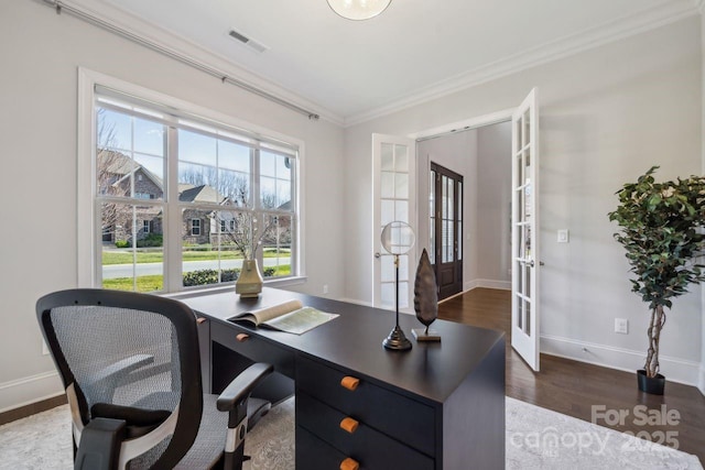 office space with dark wood-style floors, french doors, visible vents, ornamental molding, and baseboards