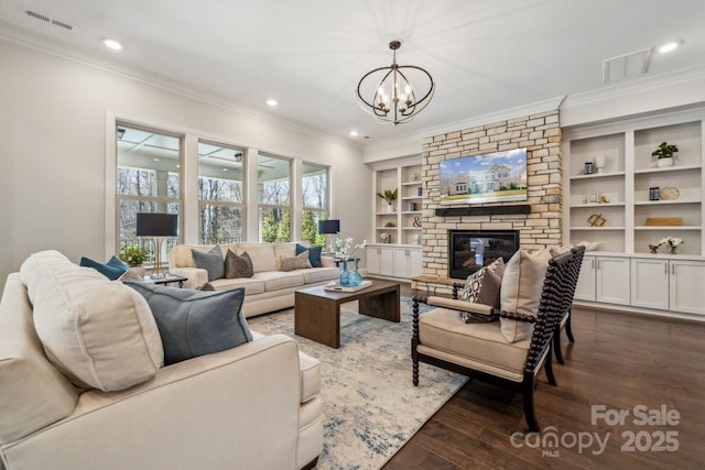 living area featuring dark wood finished floors, a fireplace, recessed lighting, visible vents, and ornamental molding