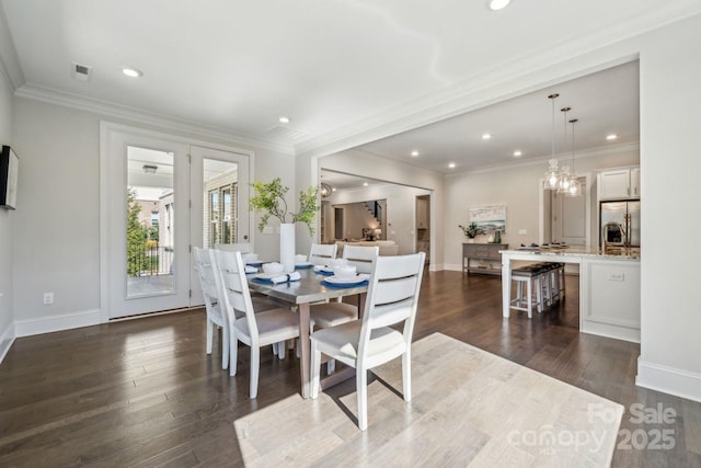 dining space featuring crown molding, visible vents, dark wood-type flooring, and recessed lighting