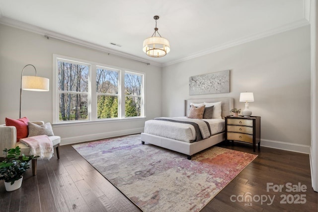 bedroom with baseboards, visible vents, ornamental molding, and dark wood-style flooring