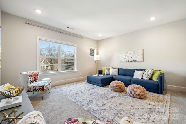 carpeted living area featuring recessed lighting, visible vents, and baseboards