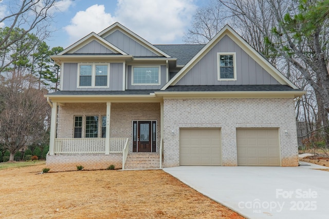 view of front of house featuring a garage and a porch