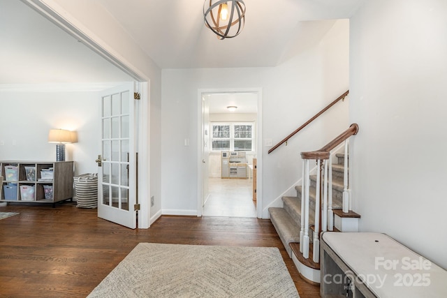 foyer with dark hardwood / wood-style floors