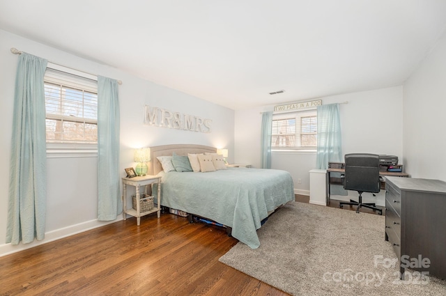 bedroom featuring dark hardwood / wood-style flooring