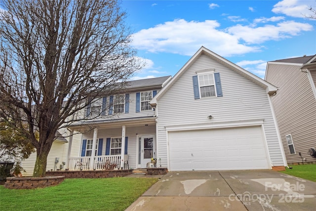 view of front of home with a porch, a garage, and a front lawn