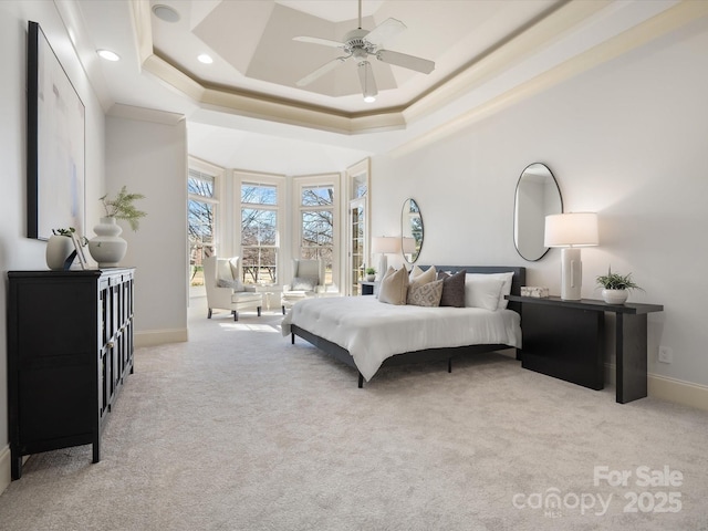 bedroom featuring carpet floors, recessed lighting, a raised ceiling, and baseboards