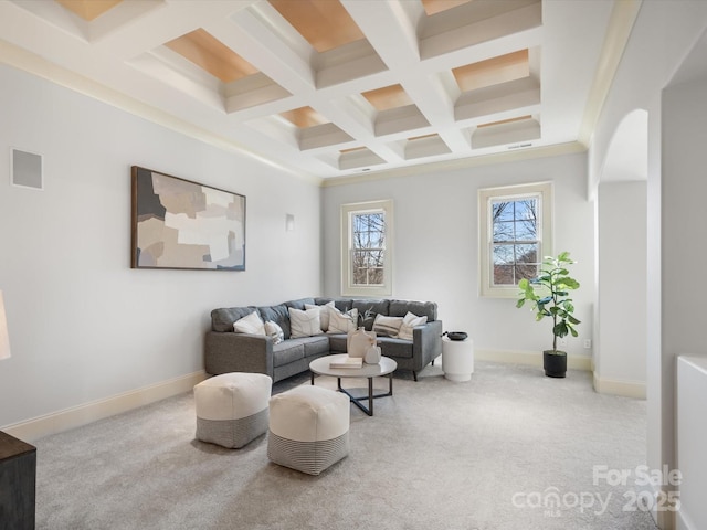 living area featuring carpet floors, beamed ceiling, visible vents, and baseboards