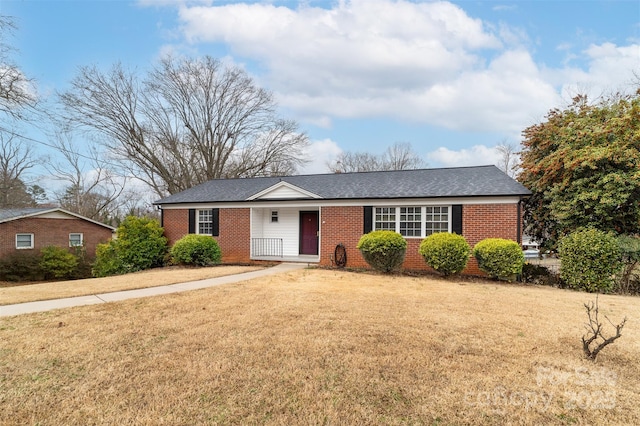 ranch-style house with a front lawn