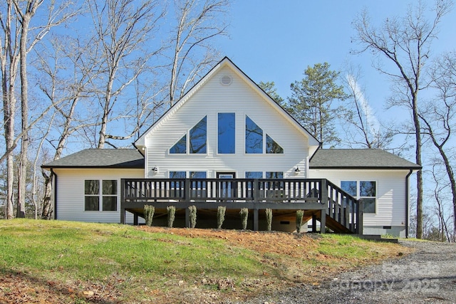 back of property featuring a yard and a deck