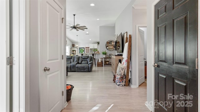 foyer entrance featuring ceiling fan and light hardwood / wood-style floors