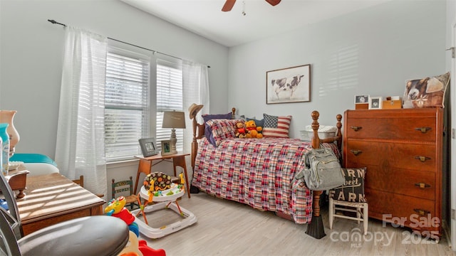 bedroom with ceiling fan and light hardwood / wood-style flooring