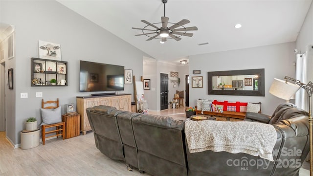 living room featuring ceiling fan, light wood-type flooring, and lofted ceiling