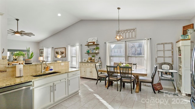 kitchen featuring a healthy amount of sunlight, pendant lighting, sink, and stainless steel dishwasher