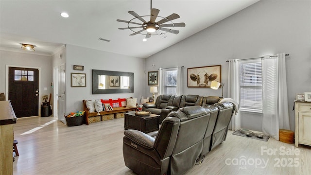 living room with ceiling fan, a wealth of natural light, and light hardwood / wood-style flooring