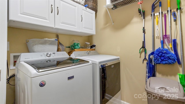 washroom featuring cabinets and independent washer and dryer