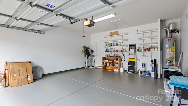 garage featuring gas water heater and a garage door opener