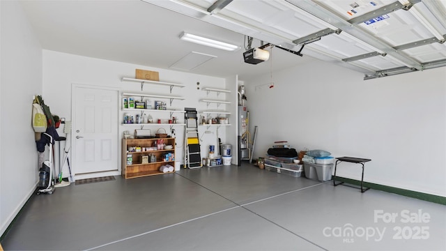 garage featuring a garage door opener, baseboards, and water heater