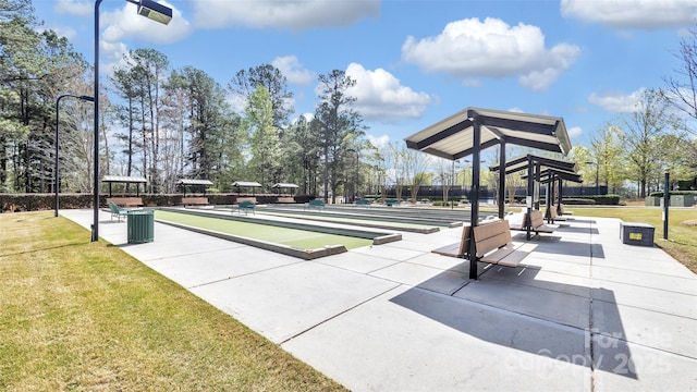 view of property's community featuring a yard