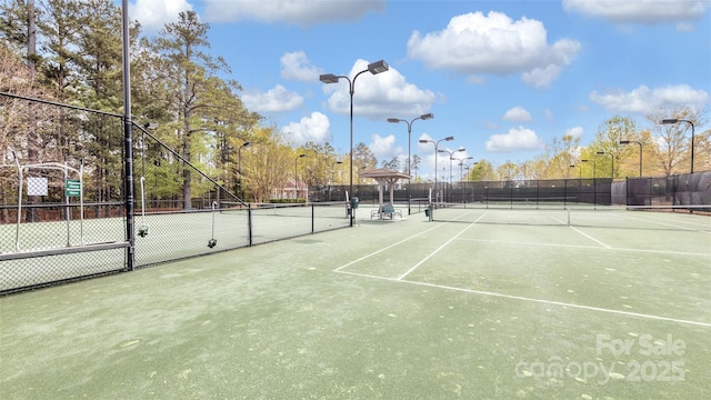 view of sport court with fence