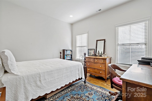 bedroom featuring wood-type flooring