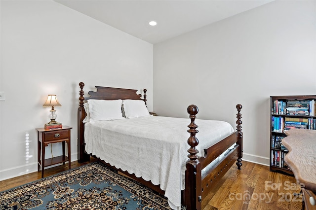 bedroom with wood-type flooring