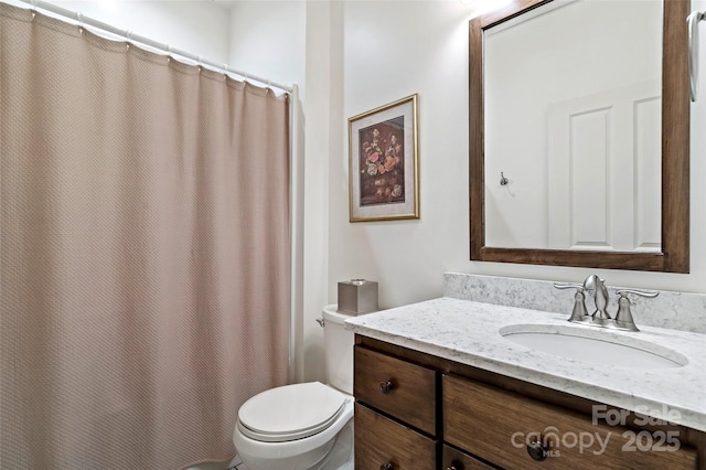 bathroom featuring vanity, toilet, and a shower with shower curtain