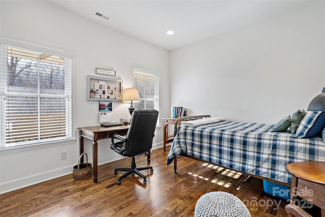 bedroom with hardwood / wood-style flooring