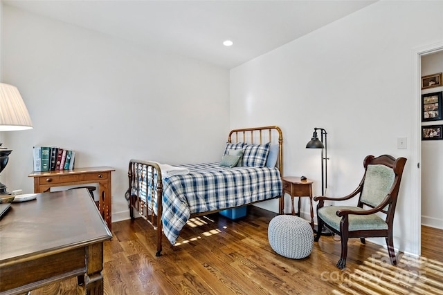 bedroom featuring wood-type flooring