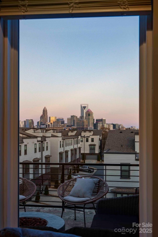 2306 Elizabeth Mill Pl, Charlotte, NC 28208 - balcony at dusk featuring a city view