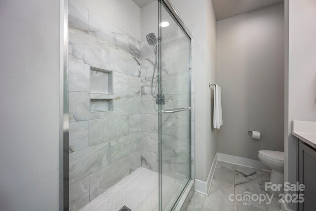 2306 Elizabeth Mill Pl, Charlotte, NC 28208 - bathroom with a stall shower, toilet, vanity, marble finish floor, and baseboards