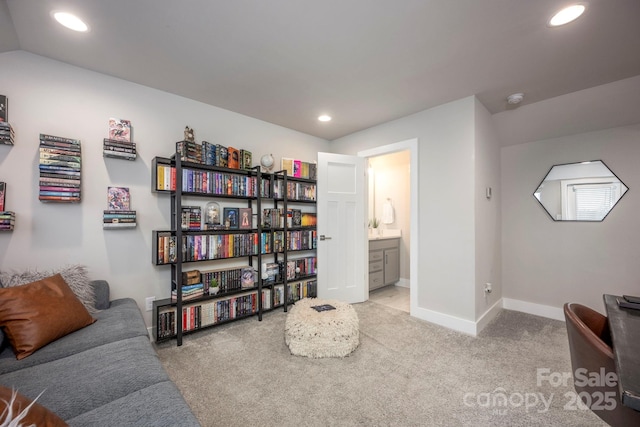 2306 Elizabeth Mill Pl, Charlotte, NC 28208 - sitting room featuring baseboards, vaulted ceiling, recessed lighting, and carpet flooring