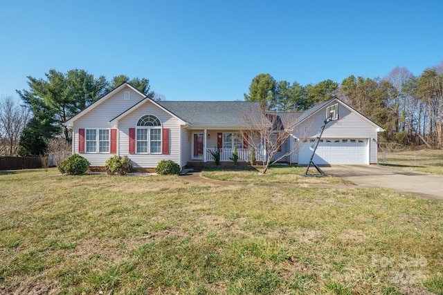 ranch-style home with a garage, a front yard, and covered porch