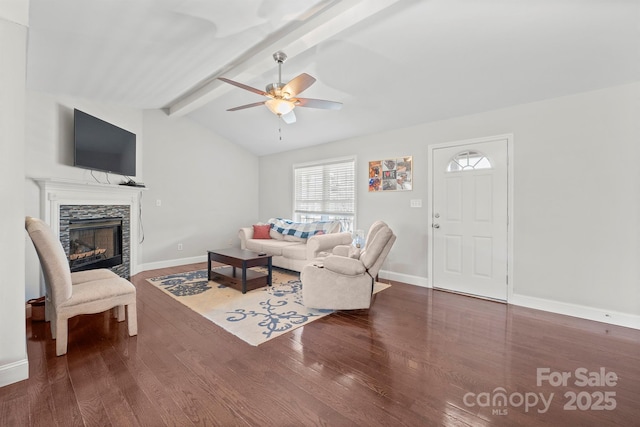 living room with dark hardwood / wood-style flooring, a fireplace, lofted ceiling with beams, and ceiling fan