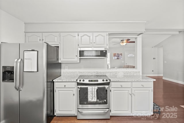 kitchen featuring ceiling fan, dark hardwood / wood-style floors, white cabinets, and appliances with stainless steel finishes