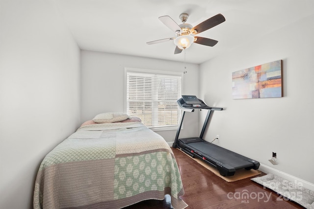 bedroom featuring dark hardwood / wood-style floors and ceiling fan