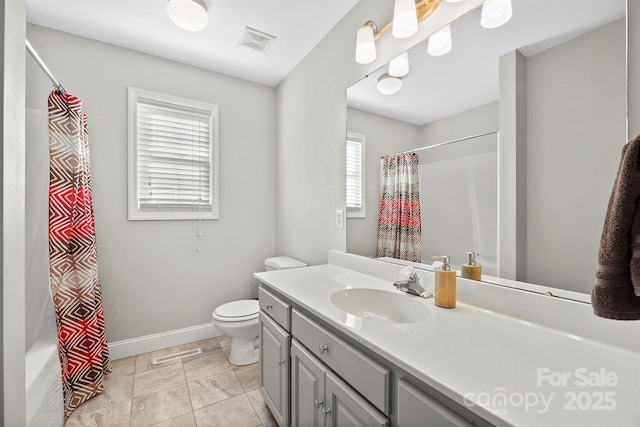 full bathroom with vanity, shower / bath combo with shower curtain, and toilet