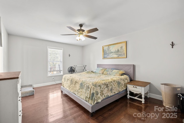 bedroom with ceiling fan and dark hardwood / wood-style flooring