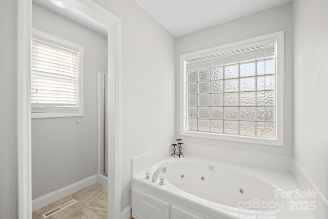 bathroom featuring a washtub