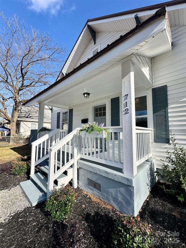 entrance to property with a porch