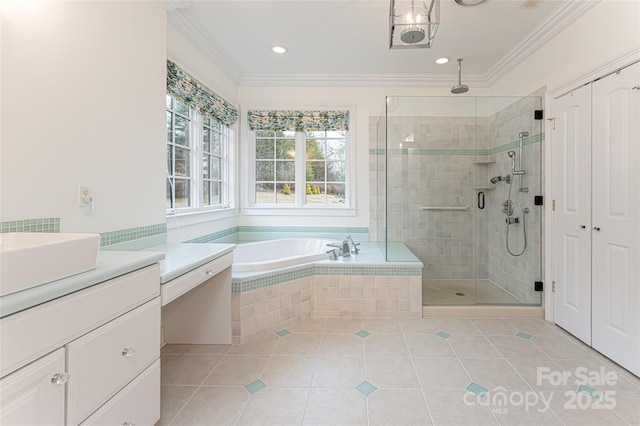 bathroom with ornamental molding, shower with separate bathtub, tile patterned flooring, and vanity