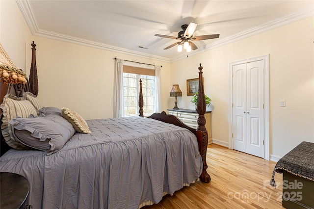 bedroom with crown molding, ceiling fan, and light hardwood / wood-style flooring