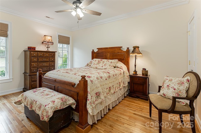 bedroom featuring crown molding, ceiling fan, and light hardwood / wood-style floors