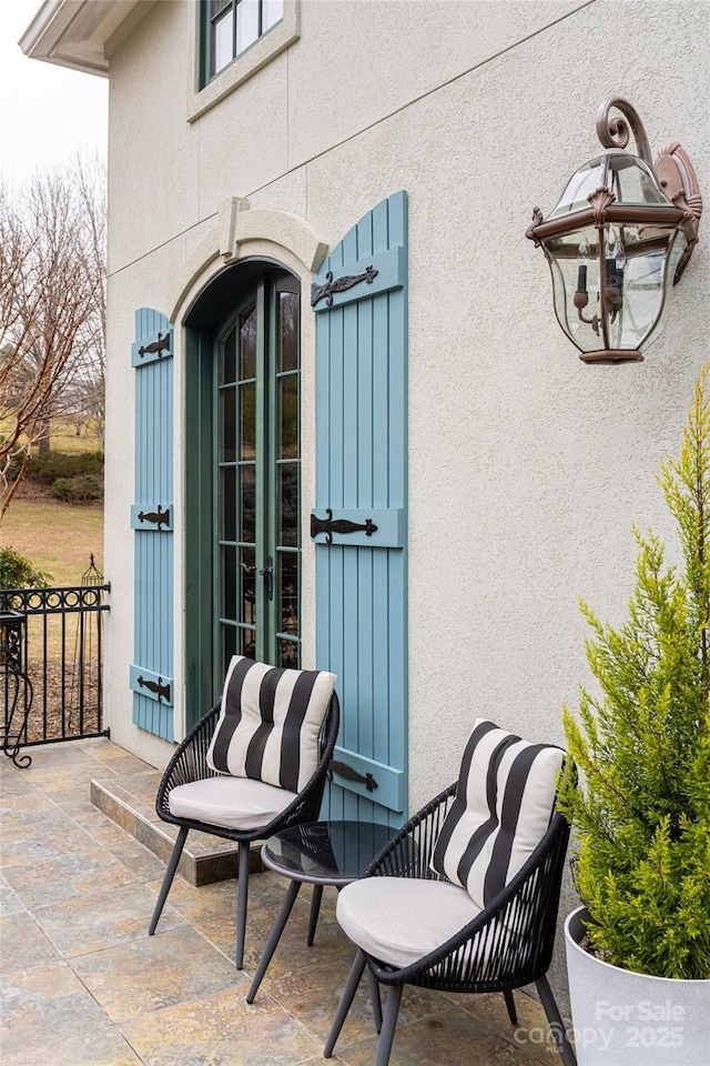 view of patio featuring french doors