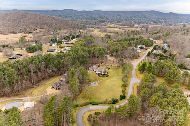 drone / aerial view featuring a mountain view