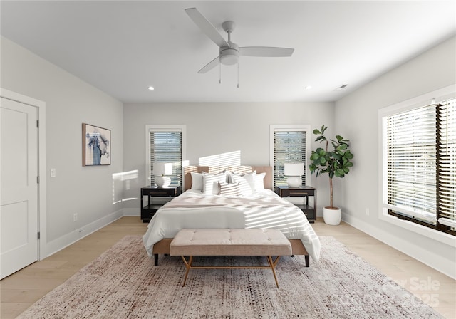 bedroom featuring baseboards, a ceiling fan, light wood-style flooring, and recessed lighting