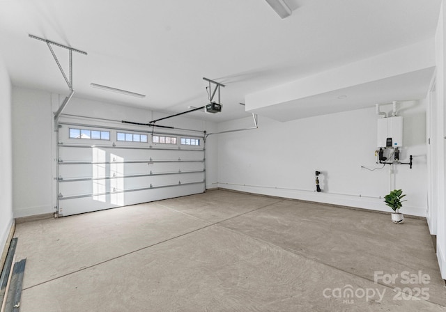 garage with tankless water heater and a garage door opener